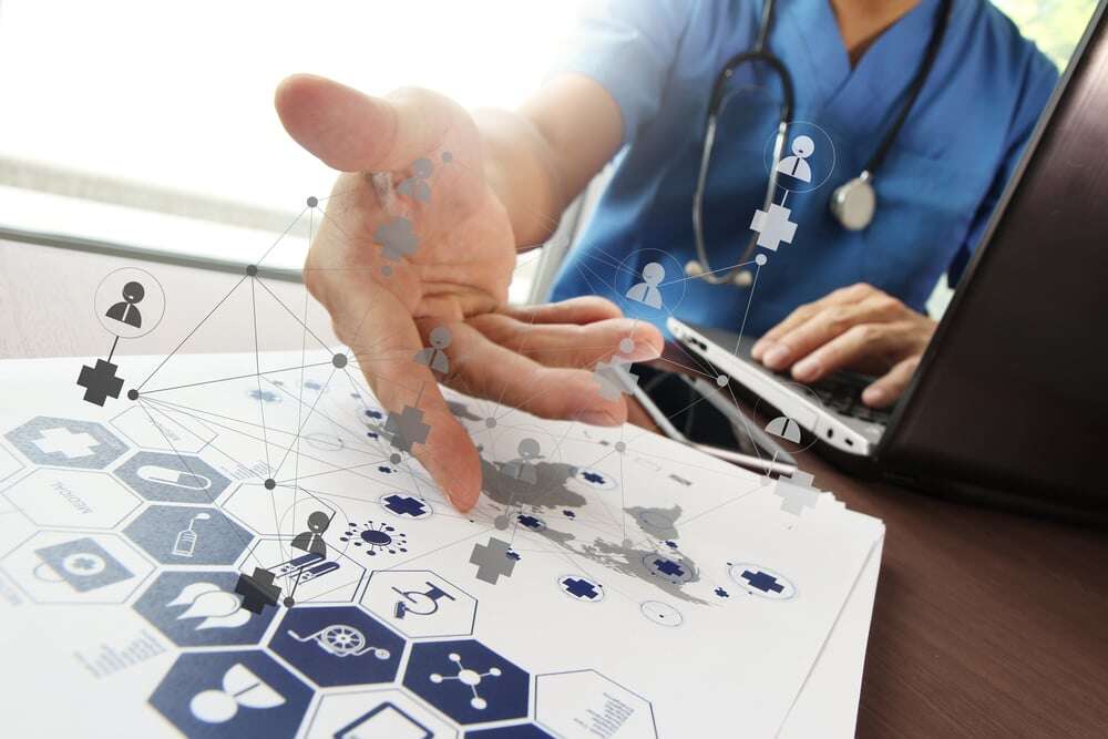 Doctor working with  laptop computer in medical workspace office and medical network media diagram as concept-1