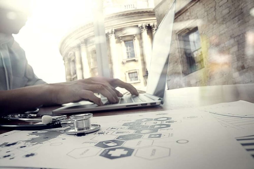 Doctor working with digital tablet and laptop computer in medical workspace office and medical network media diagram as concept