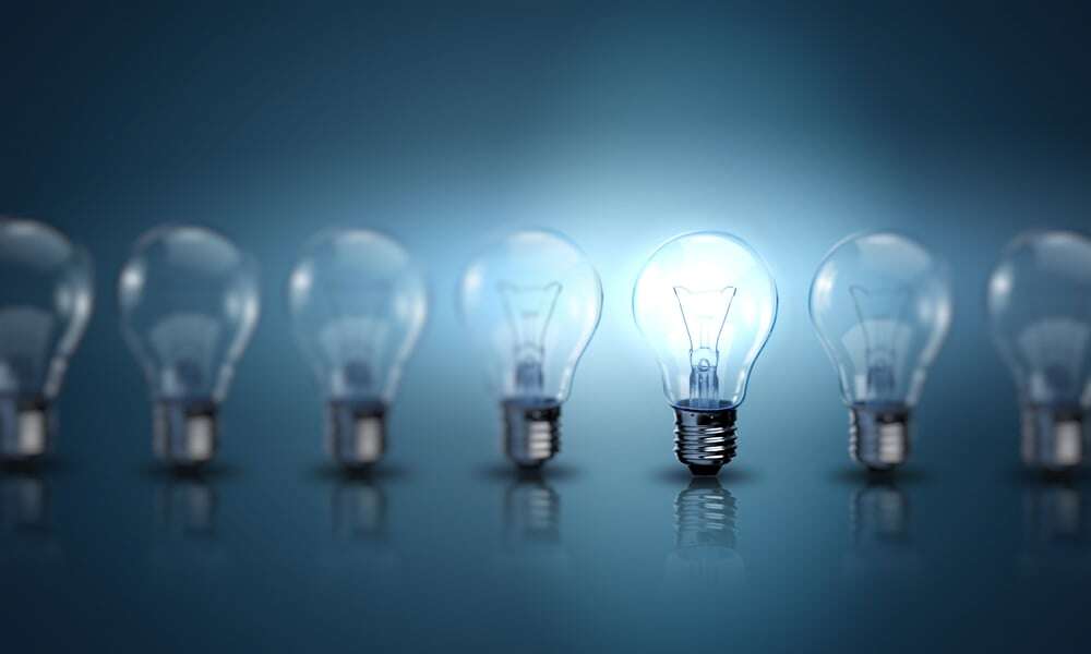 Light bulb lamps on a colour background