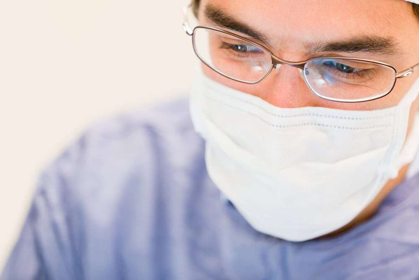 Male doctor operating in the surgery room